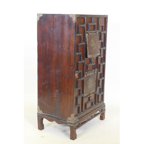 1006 - An oriental hardwood cabinet with brass mounts and auspicious character decoration, foot loose, 56 x... 