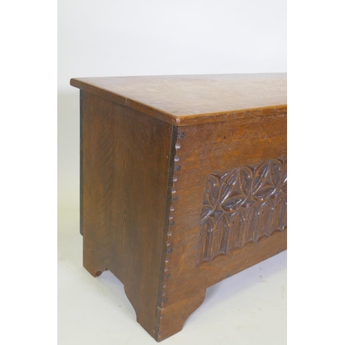 1007 - A carved oak coffer on bracket feet, one detached, 98 x 44cm, 58cm high