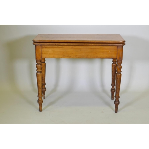 1017 - A Victorian satin walnut tea table, with fold over top, raised on turned supports, 88 x 44 x 75cm