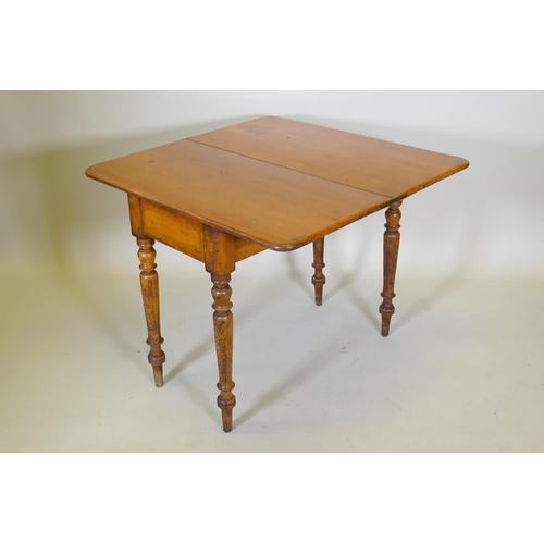 1017 - A Victorian satin walnut tea table, with fold over top, raised on turned supports, 88 x 44 x 75cm