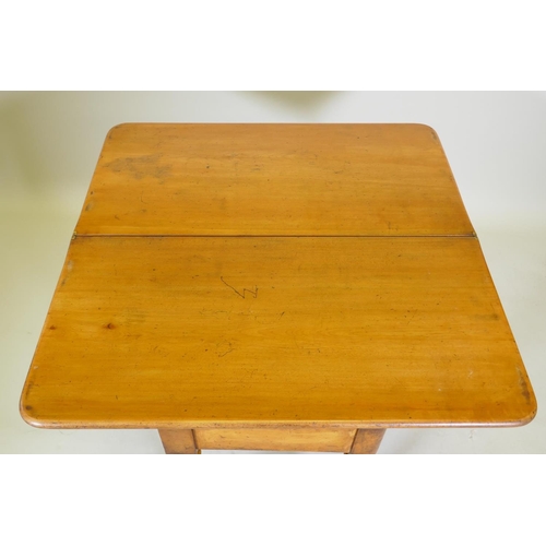 1017 - A Victorian satin walnut tea table, with fold over top, raised on turned supports, 88 x 44 x 75cm