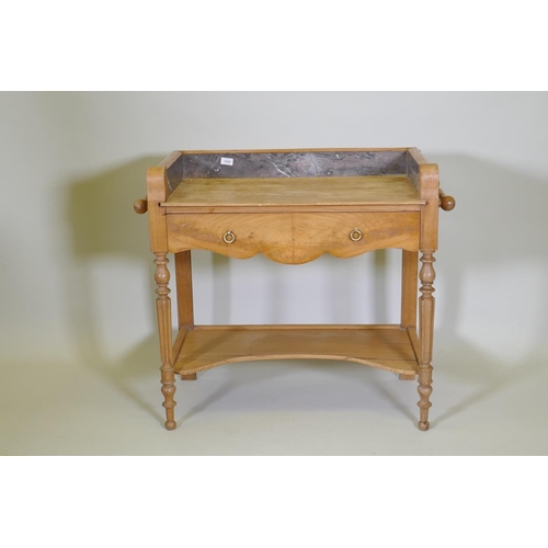 1020 - A continental elm single drawer wash stand with fitted marble three quarter gallery, raised on turne... 