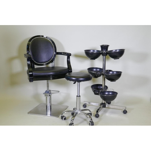 1027 - An Ayala 'Royal' hydraulic salon styling chair in black, and adjustable chrome stool on castors, and... 