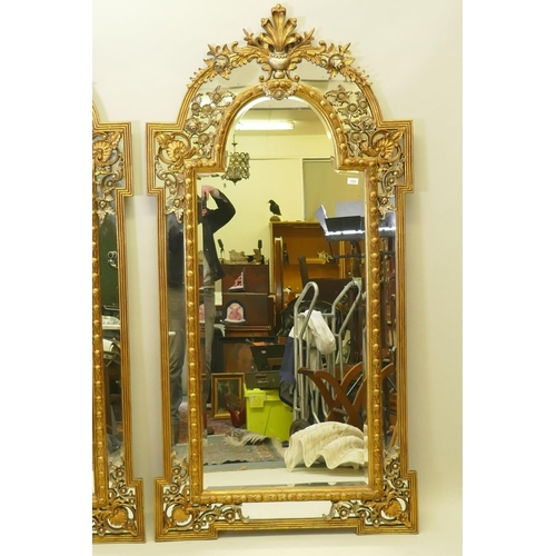 1028 - A pair of Rococo style gilt composition wall mirrors with moulded floral detail, 99 x 198cm high