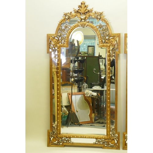 1028 - A pair of Rococo style gilt composition wall mirrors with moulded floral detail, 99 x 198cm high