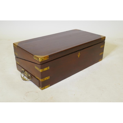 103 - A C19th mahogany writing slope with military style brass mounts and a removable book stand, 55 x 28c... 