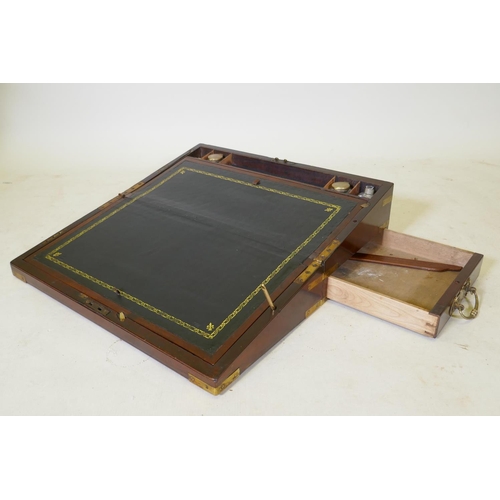 103 - A C19th mahogany writing slope with military style brass mounts and a removable book stand, 55 x 28c... 