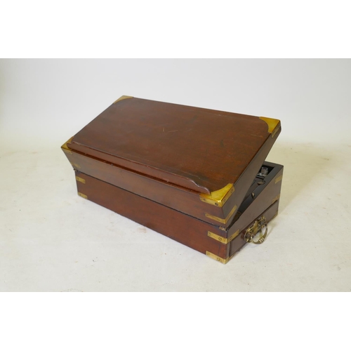 103 - A C19th mahogany writing slope with military style brass mounts and a removable book stand, 55 x 28c... 