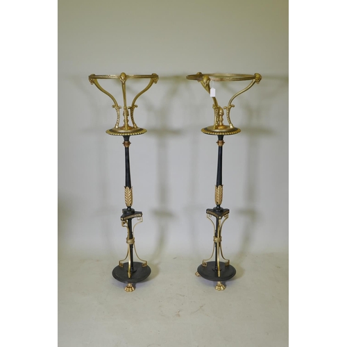 1031 - A pair of C19th Empire style iron and ormolu torcheres, adapted, 124cm high, 37cm diameter