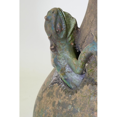 1037 - A terracotta garden vase with an applied and painted lizard, historic repair, 66cm high