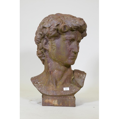 1041 - A hollow cast iron bust after Michelangelo's David, 70cm high