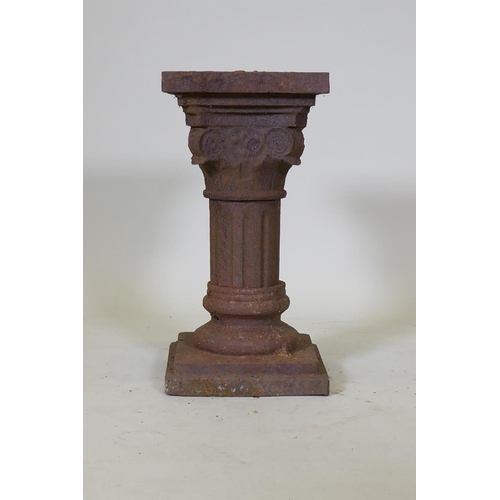 1042 - A cast iron pedestal in the form of a classical column, 25 x 25 x 50cm