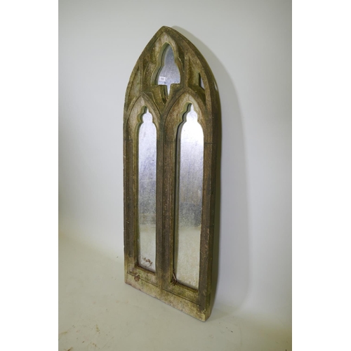 1043 - A composition Gothic style garden mirror, 58 x 145cm