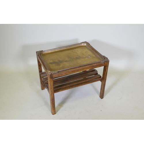 1044 - A brass and oak tray table with a slatted undertier, 64 x 49cm, 52cm high