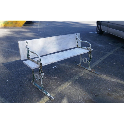 1052 - An early C20th painted cast iron and wood metamorphic railway bench/luggage table, 150 cm long