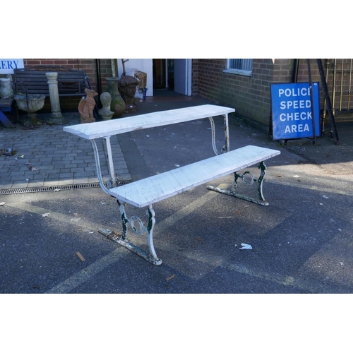 1052 - An early C20th painted cast iron and wood metamorphic railway bench/luggage table, 150 cm long