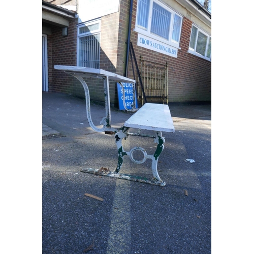 1052 - An early C20th painted cast iron and wood metamorphic railway bench/luggage table, 150 cm long