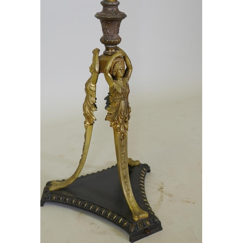 1054 - An antique bronze and ormolu standard lamp with Empire style decoration and triform base, 168cm high