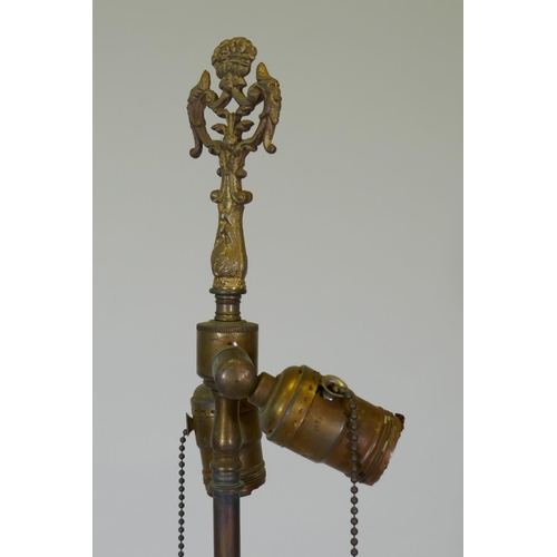 1054 - An antique bronze and ormolu standard lamp with Empire style decoration and triform base, 168cm high