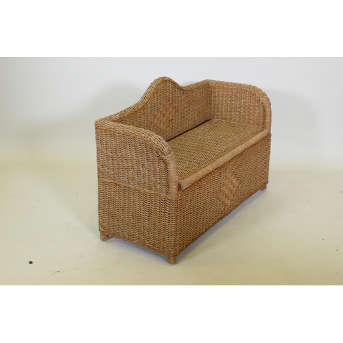 1057 - A wicker ottoman with lift up seat, 96 x 67cm high