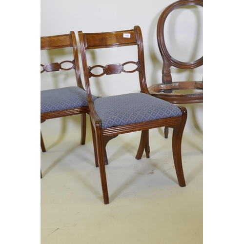 1058 - A pair of Regency mahogany side chairs with drop in seats and reeded decoration, together with a pai... 