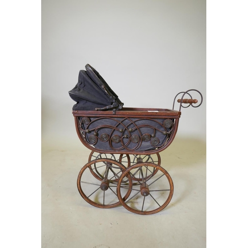 106 - A Victorian style doll's pram, 52 x 24 x 63cm