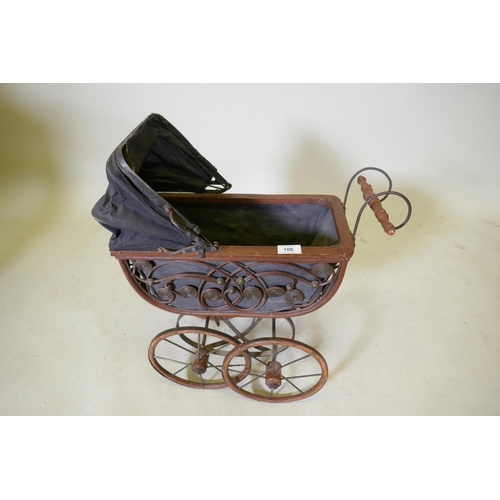 106 - A Victorian style doll's pram, 52 x 24 x 63cm