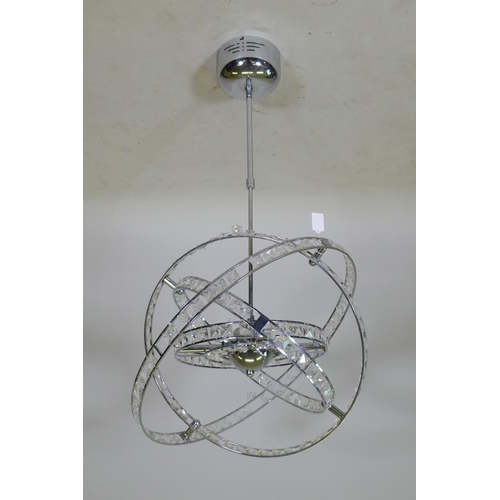 1061 - A contemporary chromed metal gimbal ceiling lamp, A/F, 56cm diameter, 82cm long