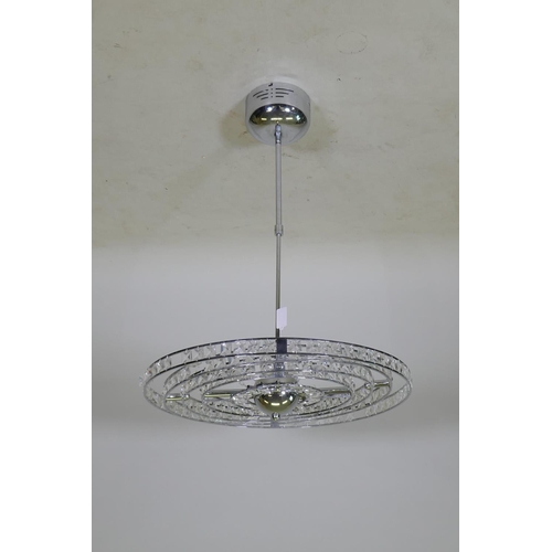 1061 - A contemporary chromed metal gimbal ceiling lamp, A/F, 56cm diameter, 82cm long