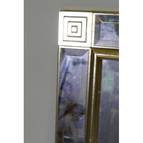 1068 - A contemporary wall sectioned wall mirror with bevelled glass and gilt frame, 90 x 65cm