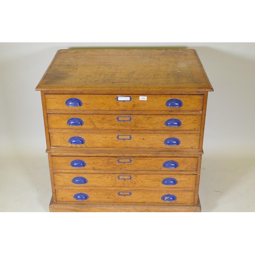 1070 - An early C20th golden oak plan chest in two sections of three drawers, 95 x 69cm, 89cm high