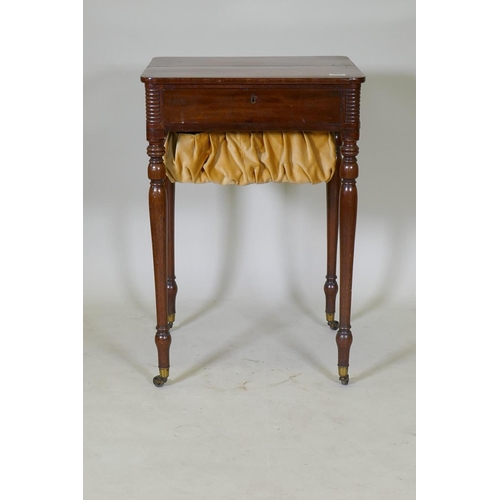 1073 - A Regency mahogany workbox, with candle slide and drawer with slope and pull out pen tray, and box, ... 