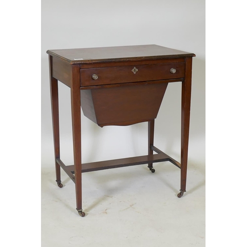 1074 - A C19th mahogany work table, the single drawer with fitted interior and pull out basket under, raise... 