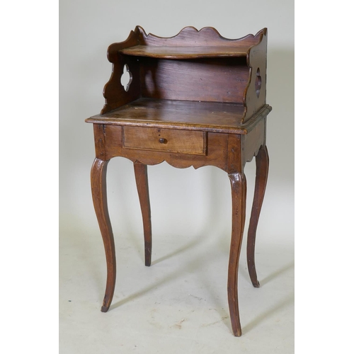 1075 - An early C19th French fruitwood single drawer side table with shaped gallery and pierced sides, rais... 