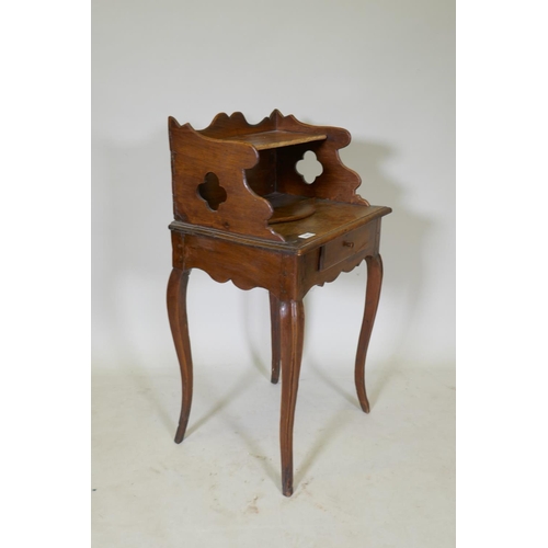 1075 - An early C19th French fruitwood single drawer side table with shaped gallery and pierced sides, rais... 