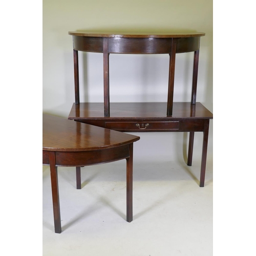 1079 - A Georgian mahogany dining table in three sections, two demi lune end sections and a centre section ... 