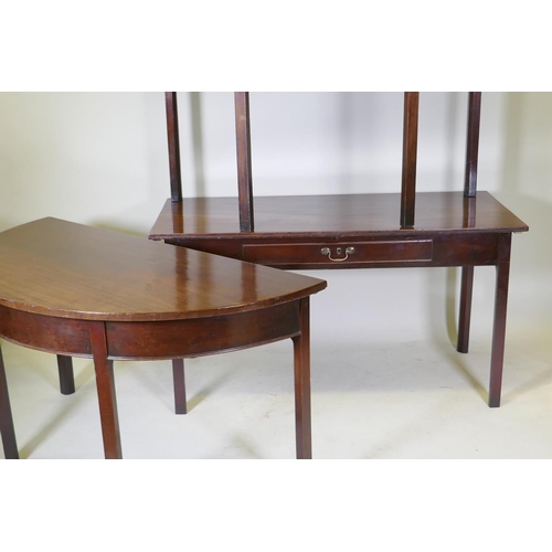 1079 - A Georgian mahogany dining table in three sections, two demi lune end sections and a centre section ... 