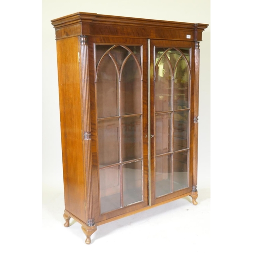 1081 - A Regency mahogany bookcase top with reeded columns flanking two gothic astragal glazed doors, raise... 