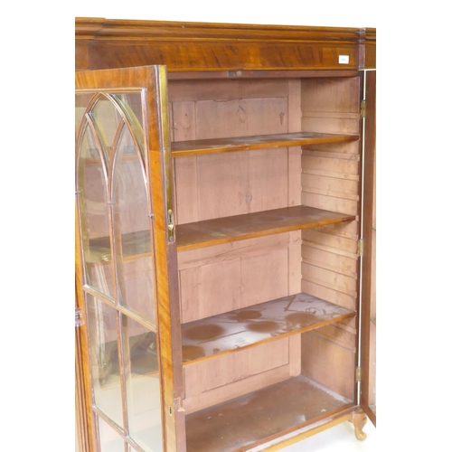 1081 - A Regency mahogany bookcase top with reeded columns flanking two gothic astragal glazed doors, raise... 