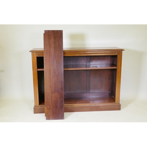 1082 - An Anglo-Indian rosewood open bookcase with brass inlaid decoration and two adjustable shelves, rais... 