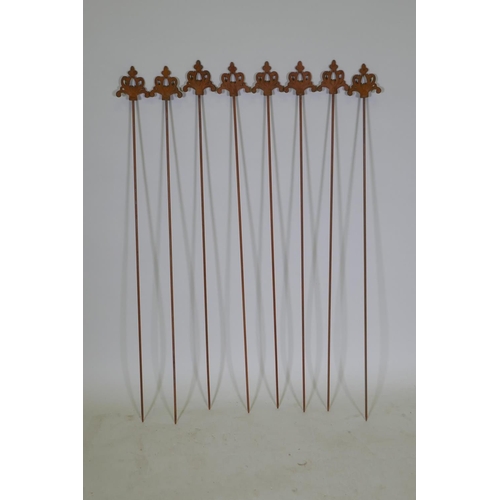 1085 - A set of eight cast iron gothic style plant stakes, 106cm long