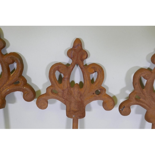 1085 - A set of eight cast iron gothic style plant stakes, 106cm long