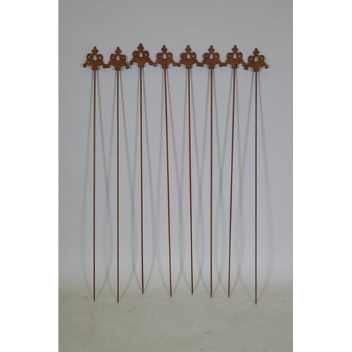 1086 - A set of eight cast iron gothic style plant stakes, 106cm long