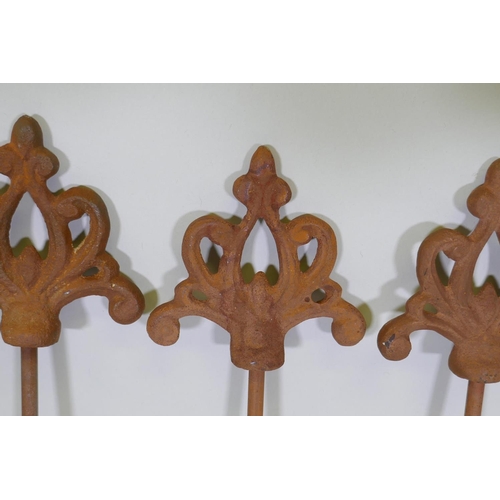 1086 - A set of eight cast iron gothic style plant stakes, 106cm long