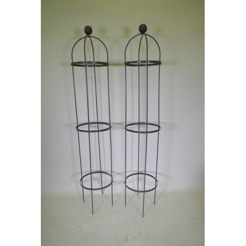 1087 - A pair of wrought iron plant obelisks, 190cm high