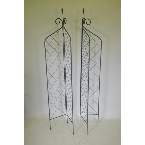 1088 - A pair of folding wrought iron folding garden trellises, 214cm high