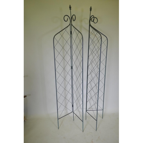 1088 - A pair of folding wrought iron folding garden trellises, 214cm high