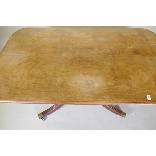 1092 - A mahogany breakfast table with an associated top, 95 x 148cm, 73cm high