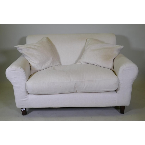 1094 - A Habitat two seater sofa with cream coloured linen covers, 140cm wide