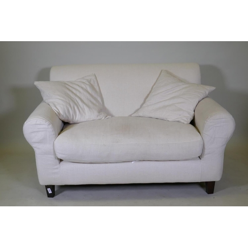 1095 - A Habitat two seater sofa with cream coloured linen covers, 140cm wide 